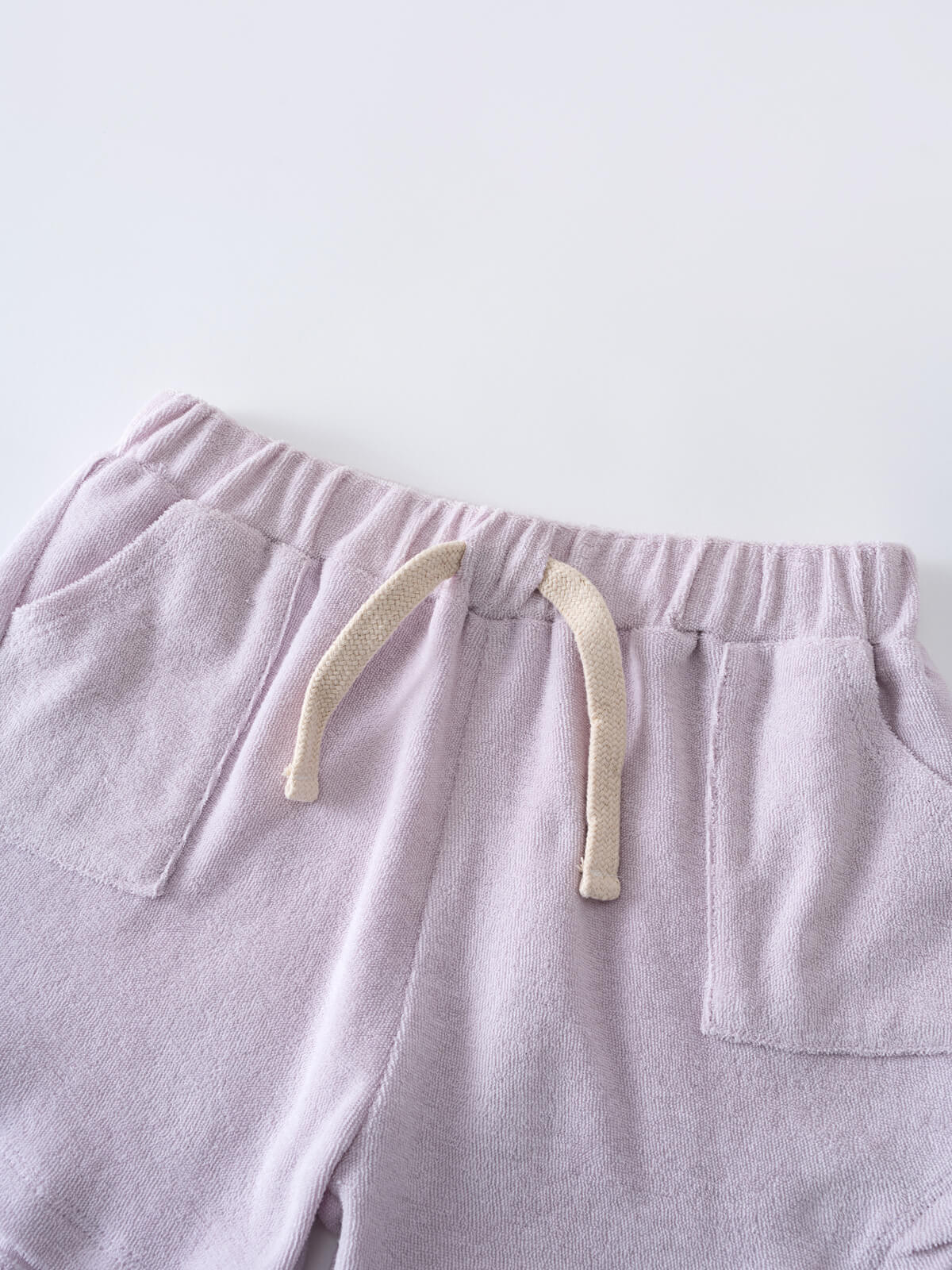 Close-up of lilac terry cloth shorts with cream drawstring and elastic waistband Towelling Shorts - Lilac Girls