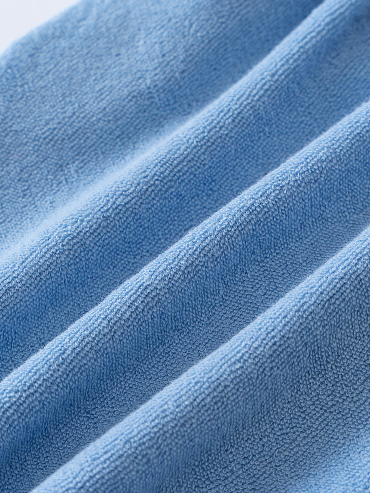 Close-up of light blue towelling fabric with visible texture and folds Towelling Shorts - Sky Blue Boys