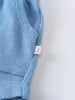 Close-up of blue terry cloth shorts with small beige label tag Towelling Shorts - Sky Blue Boys