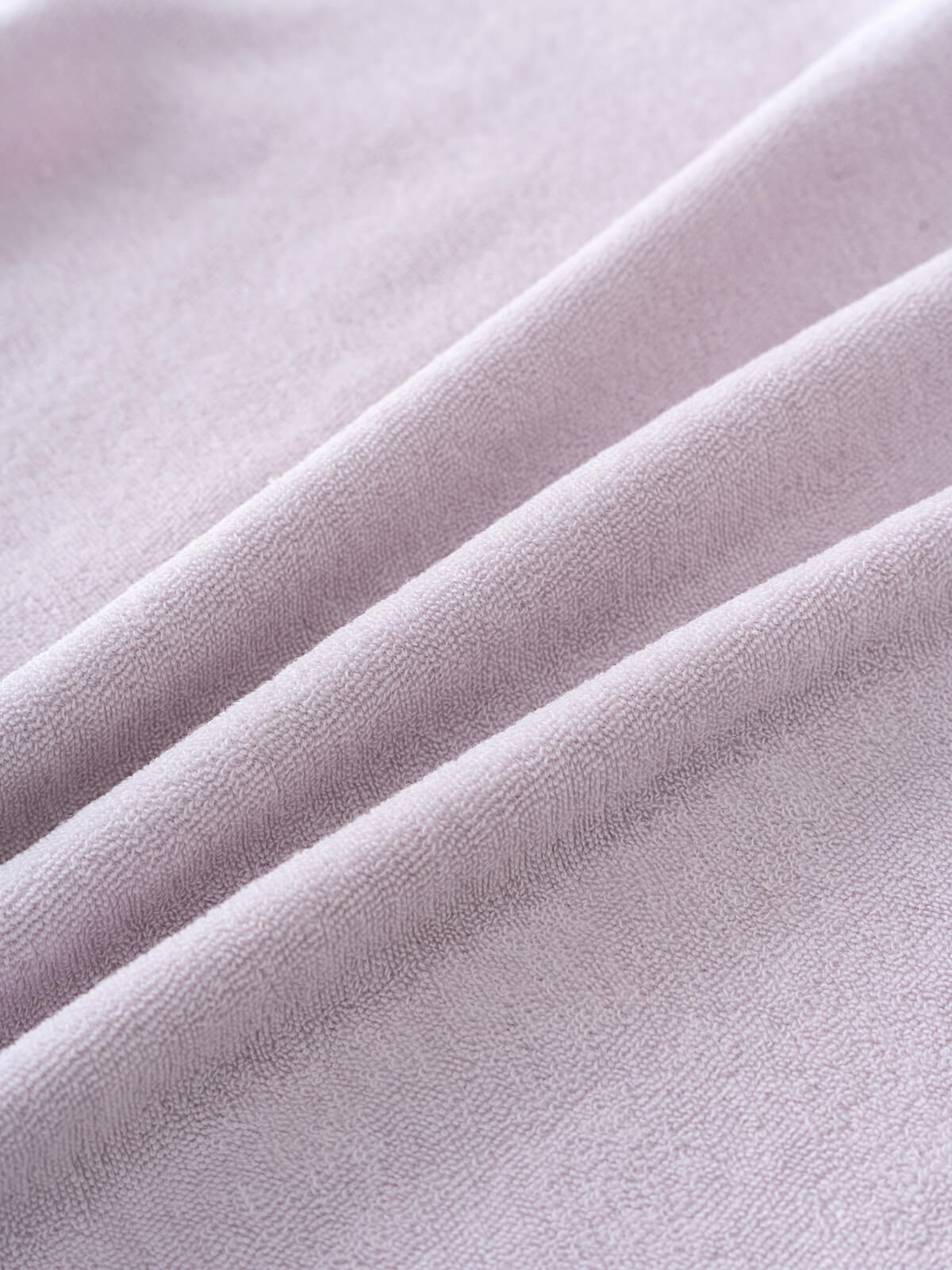 Close-up of soft lilac terry cloth fabric with gentle folds Towelling Tee Shirt - Lilac Girls
