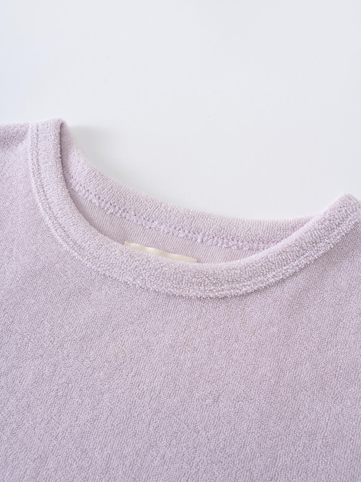 Close-up of a light purple towelling fabric neckline with ribbed trim Towelling Tee Shirt - Lilac Girls