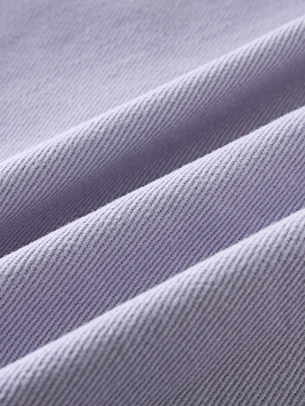 Close-up of light purple fabric with textured diagonal weave pattern twill Jacket - Lilac Girls
