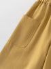 Close-up of mustard yellow pants with a pocket on a light gray background Twill Pants - Golden Pear Boys