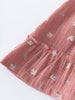 Pink textured fabric with small patterns on a white background Woven Skirt - Bird And Blossom Rosehip Girls