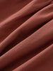 Close-up of draped terracotta-colored woven fabric with visible diagonal texture Woven Skirt - Rosehip Girls