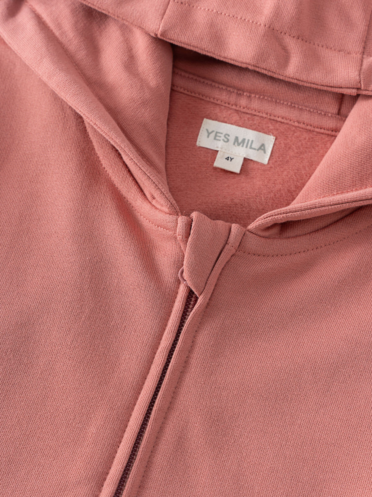 Close-up of a pink hoodie showing zipper and label detail Zip Hoodie - Rosehip Boys
